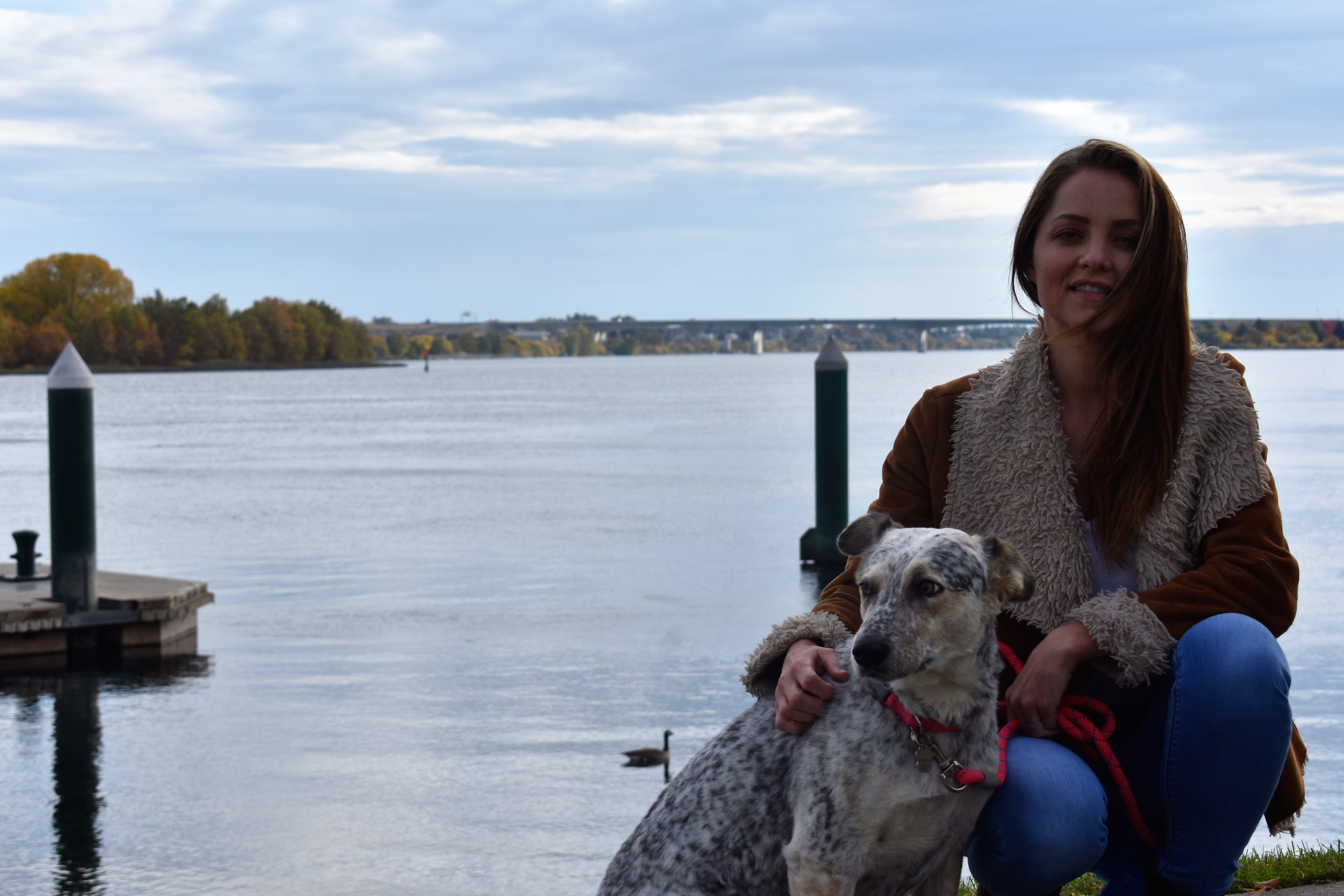 amber smiling with dog on a dock