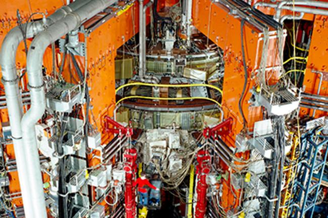 The Joint European Torus (JET) magnetic fusion experiment with myriad multi-colored heating, cooling, and measuring systems.